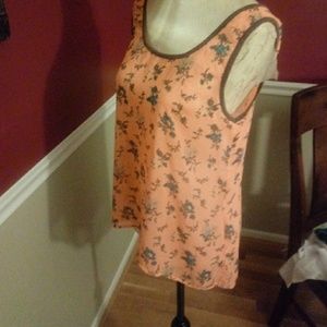 Sheer sleeveless top with high low hemline